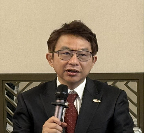 Dr Esther Huang speaking at an event